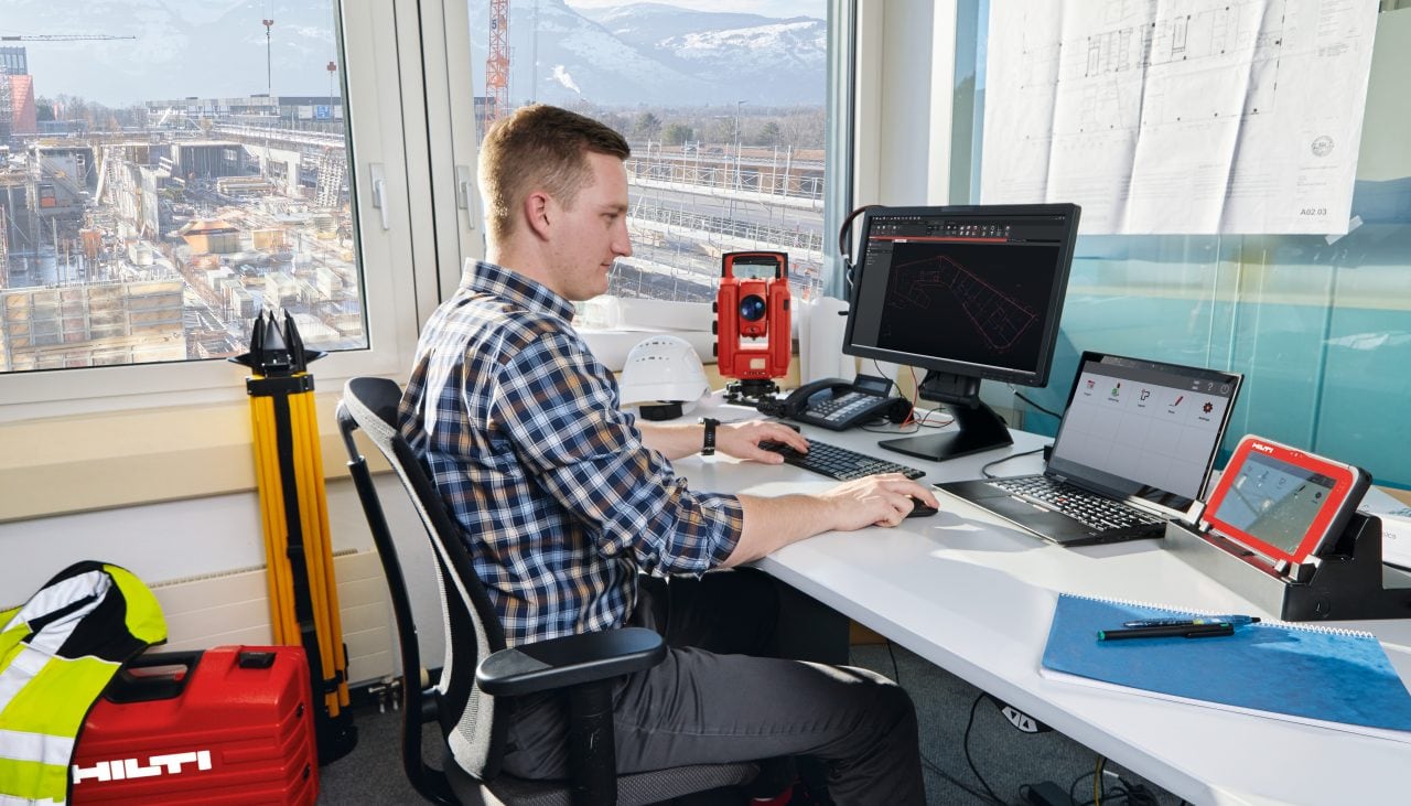 man using Hilti laser software on his laptop