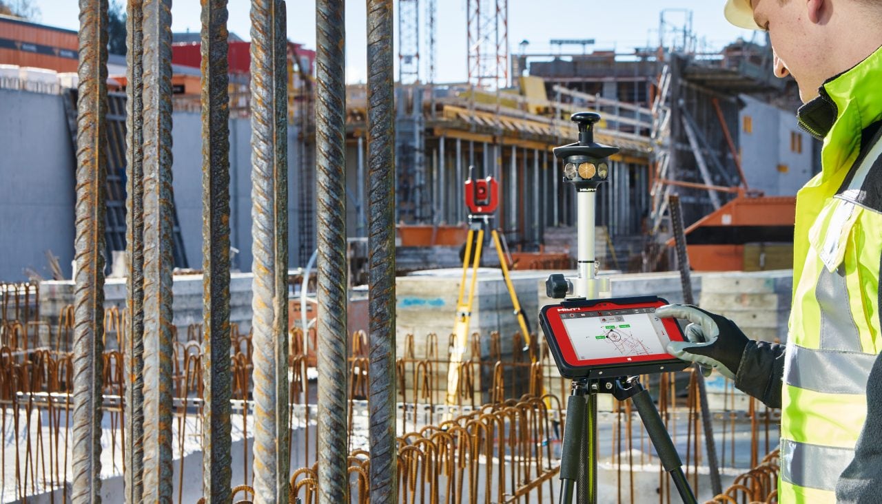 man using Hilti laser software on a tablet