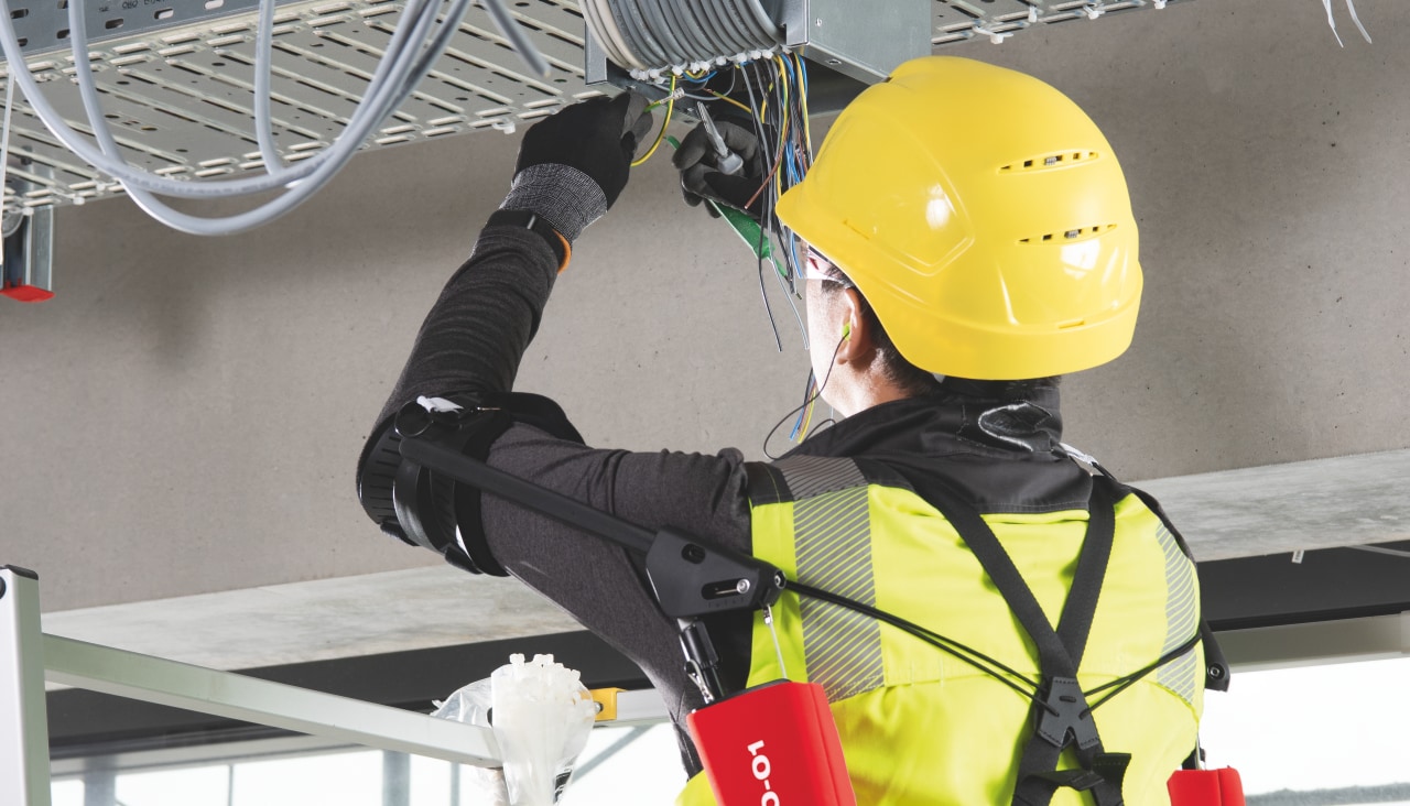 man wearing Hilti exoskeleton