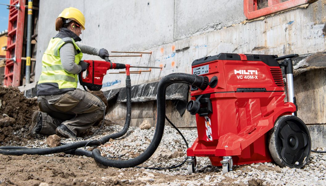 Hilti rotary hammer used on a jobsite with the vacuum cleaner