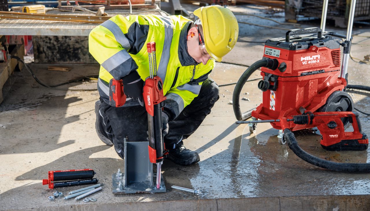man using hilti tools for a baseplate application