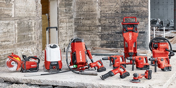 red hilti tools displayed on a concrete floor