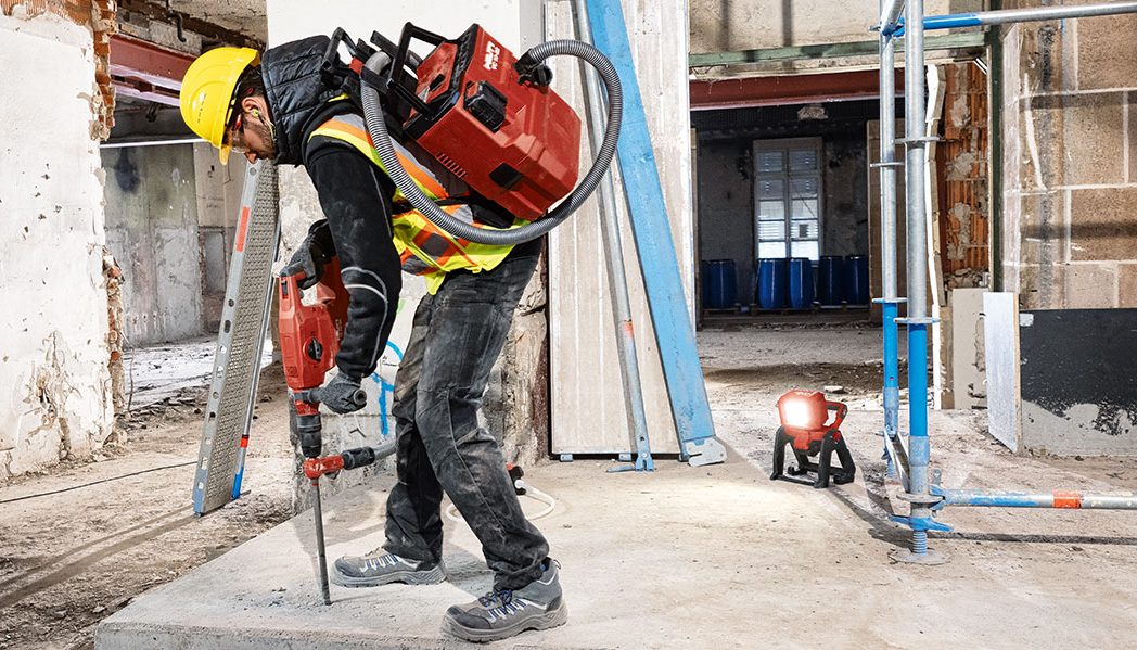 A worker using Hilti Nuron TE 60-22 to break concrete