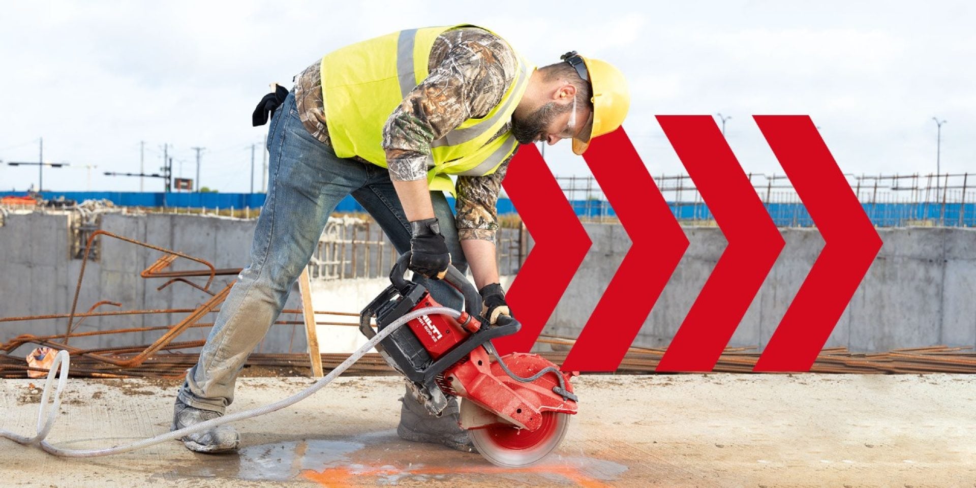 A worker cuts concrete with the Hilti Nuron DSH 600-22 battery-powered angle grinder.