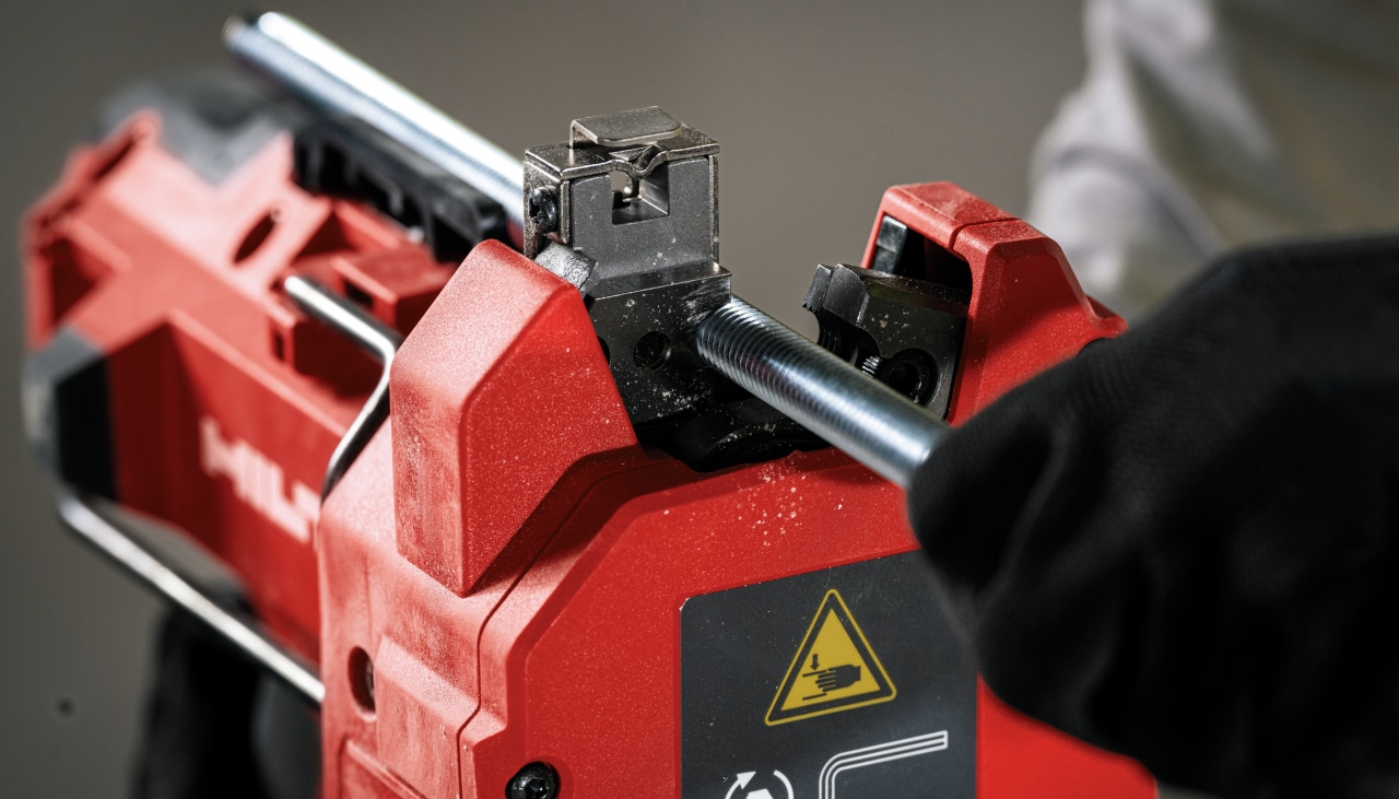 jobsite worker using rod cutter