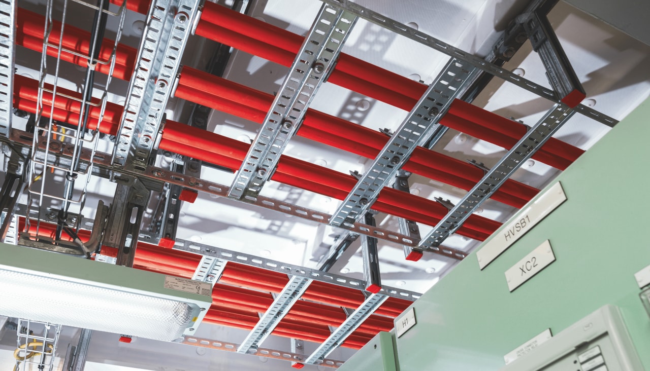 image of red piping being supported by Hilti channel system
