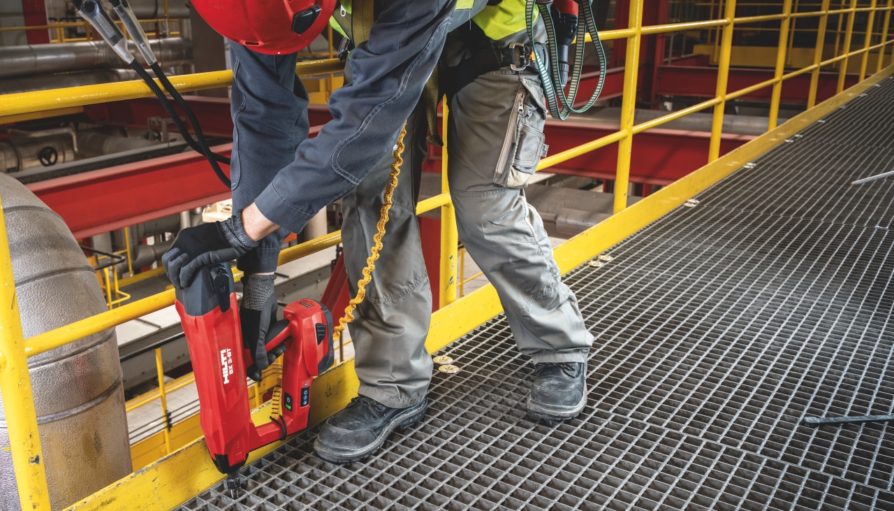 man holding a hilti nail gun