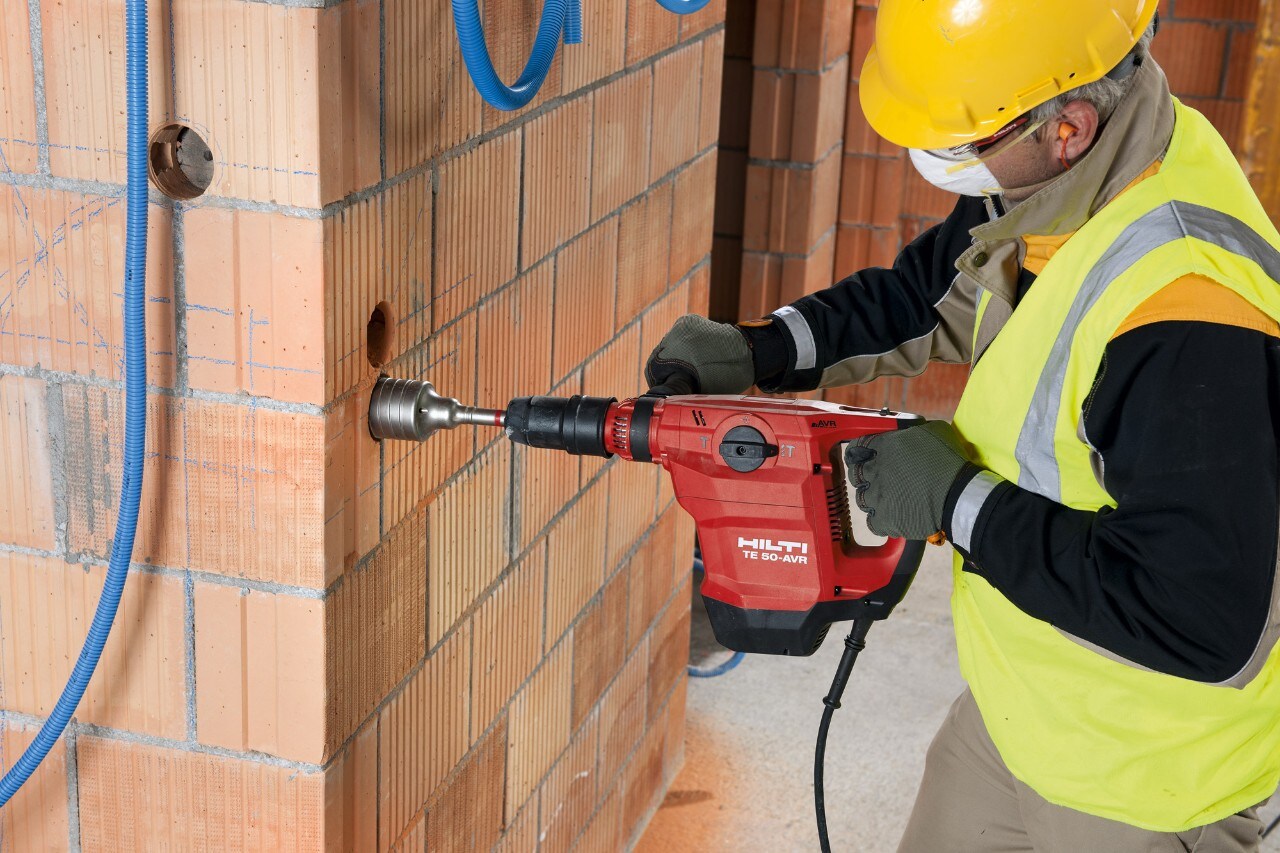 Construction worker using a Hilti Rotary Hammer