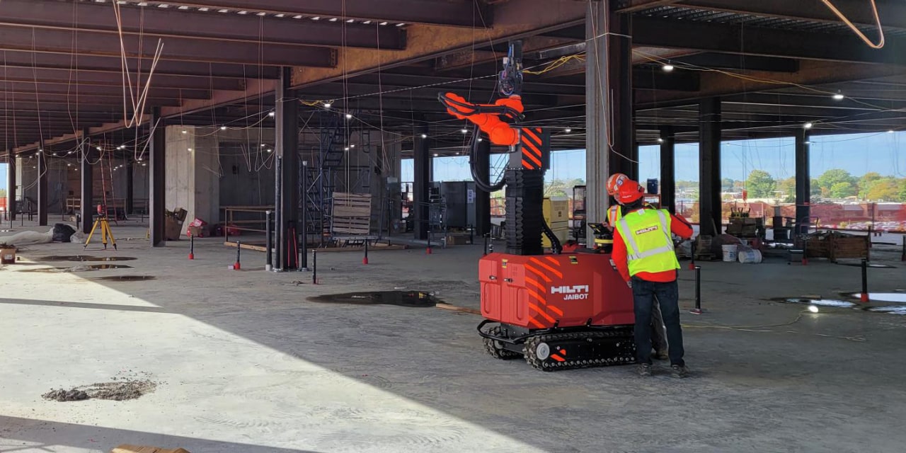 man using Hilti Jaibot construction robot