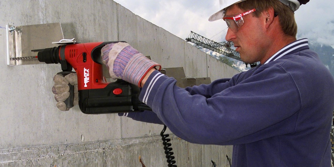 1970's Construction worker using a drill