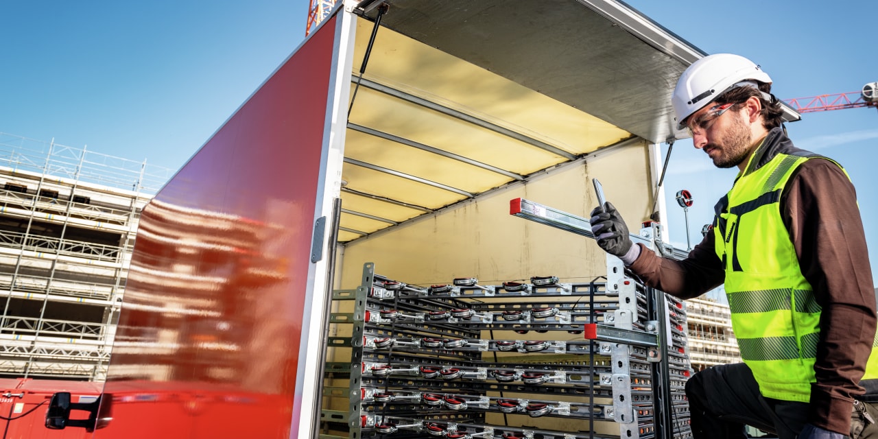 man tracking his deliveries on his phone