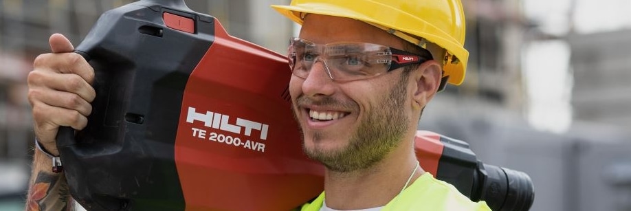 man walking with a Hilti breaker