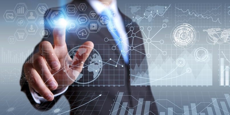Businessman in his office during a presentation with charts screens