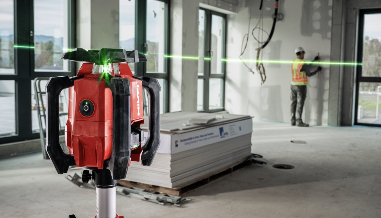 man using Hilti rotating laser on jobsite