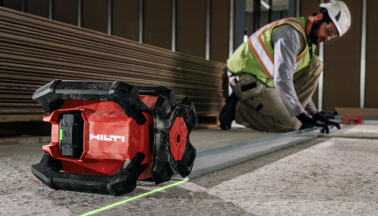 man using Hilti rotating laser on jobsite