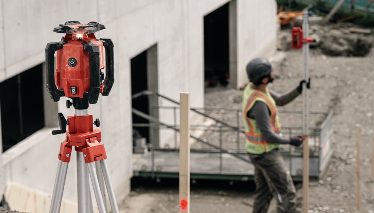 man using Hilti rotating laser on jobsite