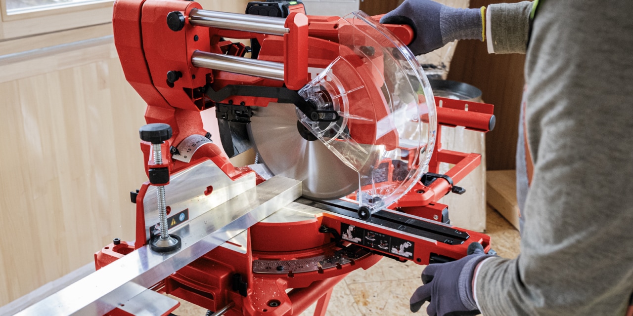 man using hilti mitre saw