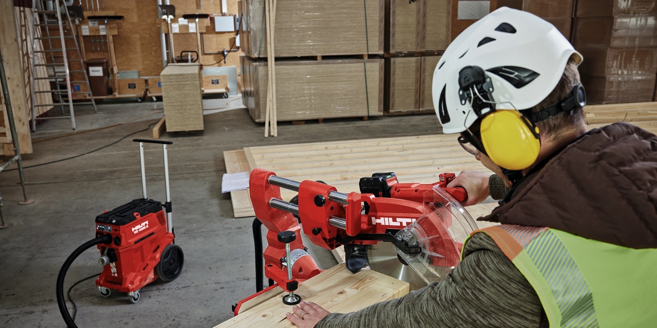 man using hilti mitre saw