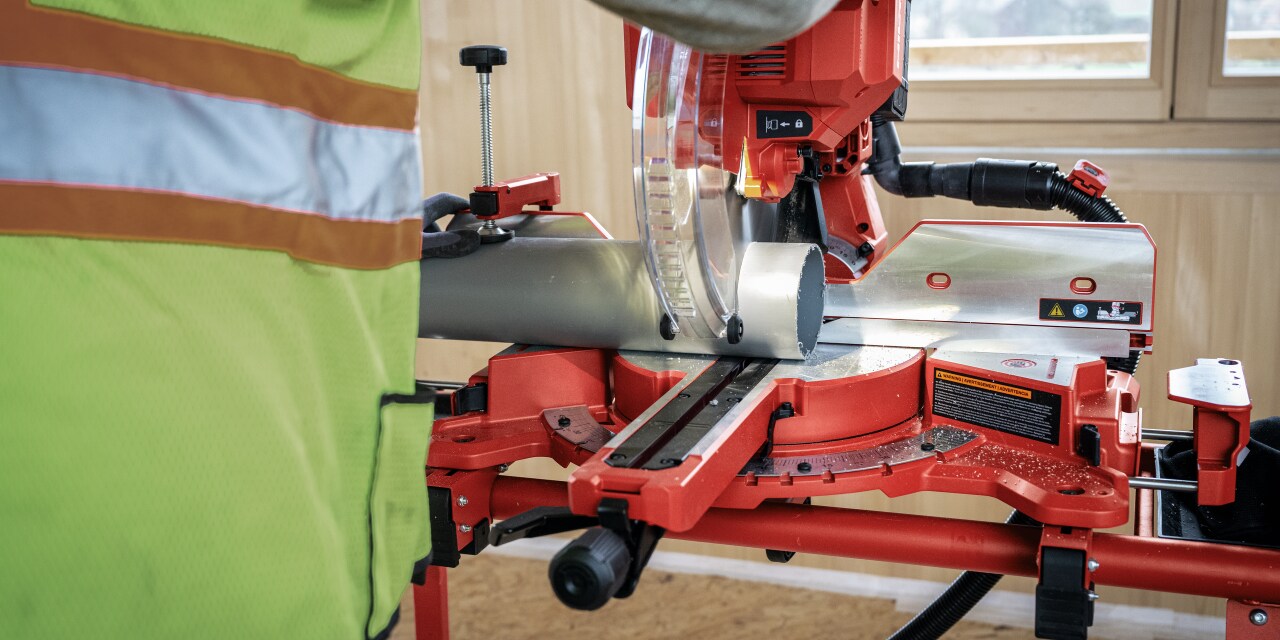 man using hilti mitre saw