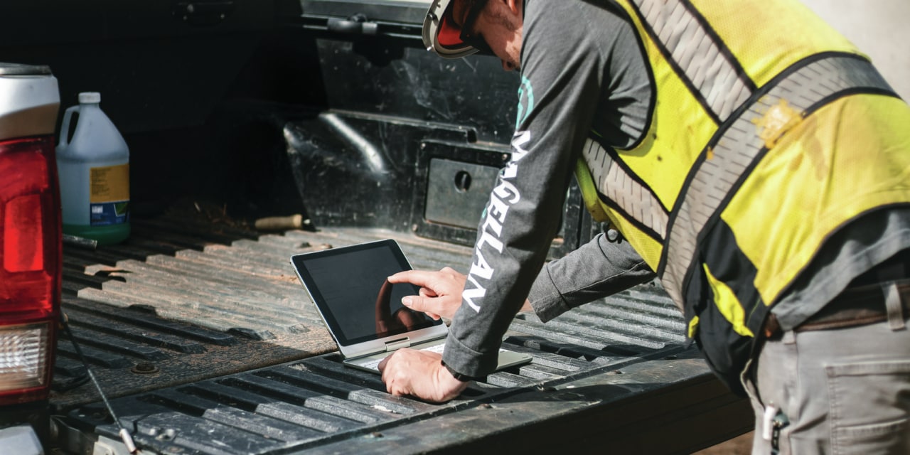 man working with a tablet on the jobsite