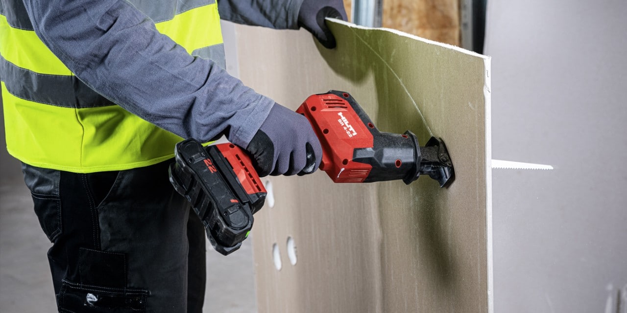 construction worker using Hilti tool