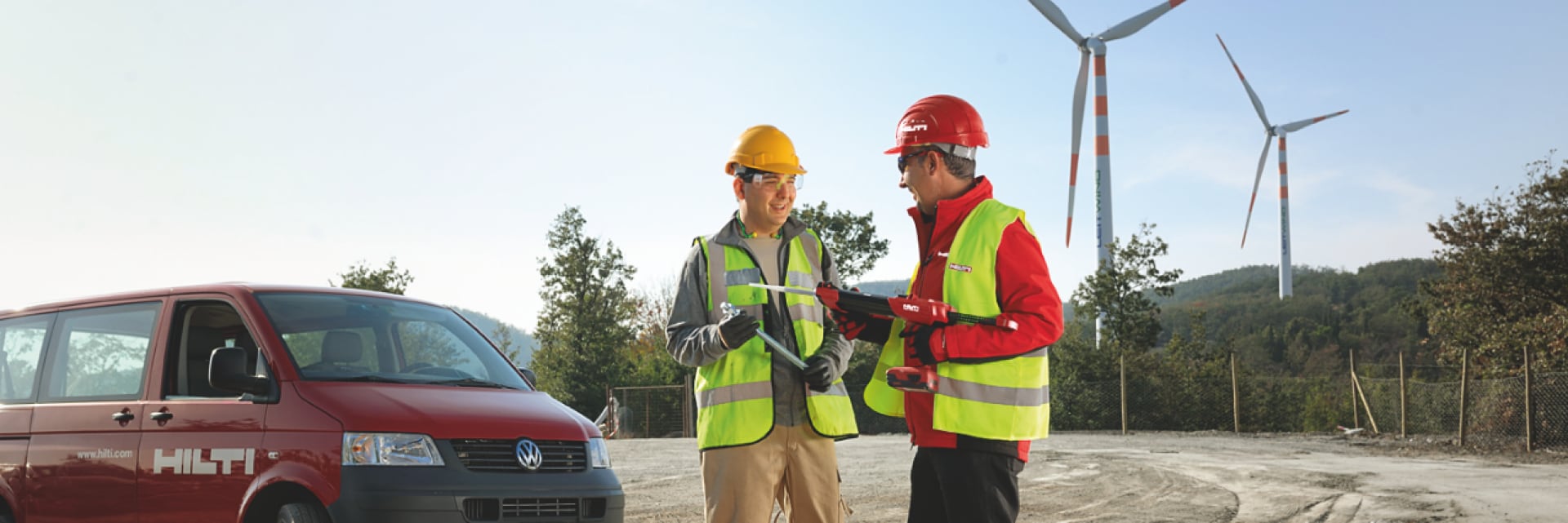 men onsite discussing sustainability