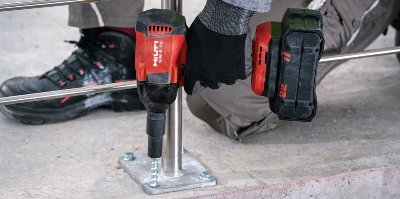 man using Hilti's hex head screw anchors