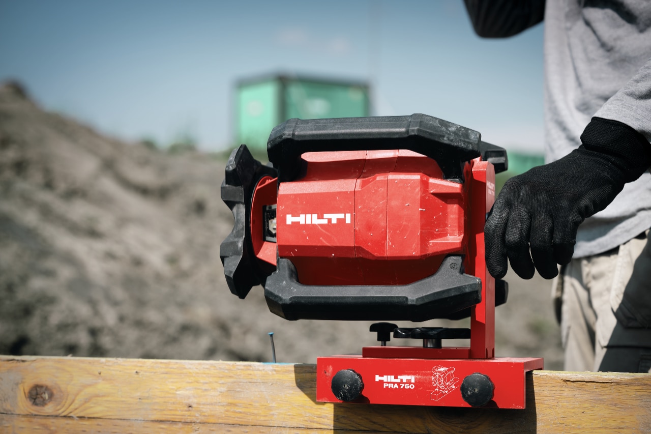 man using Hilti rotating laser on jobsite