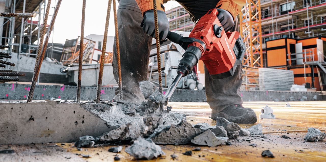 man using drill driver on jobsite