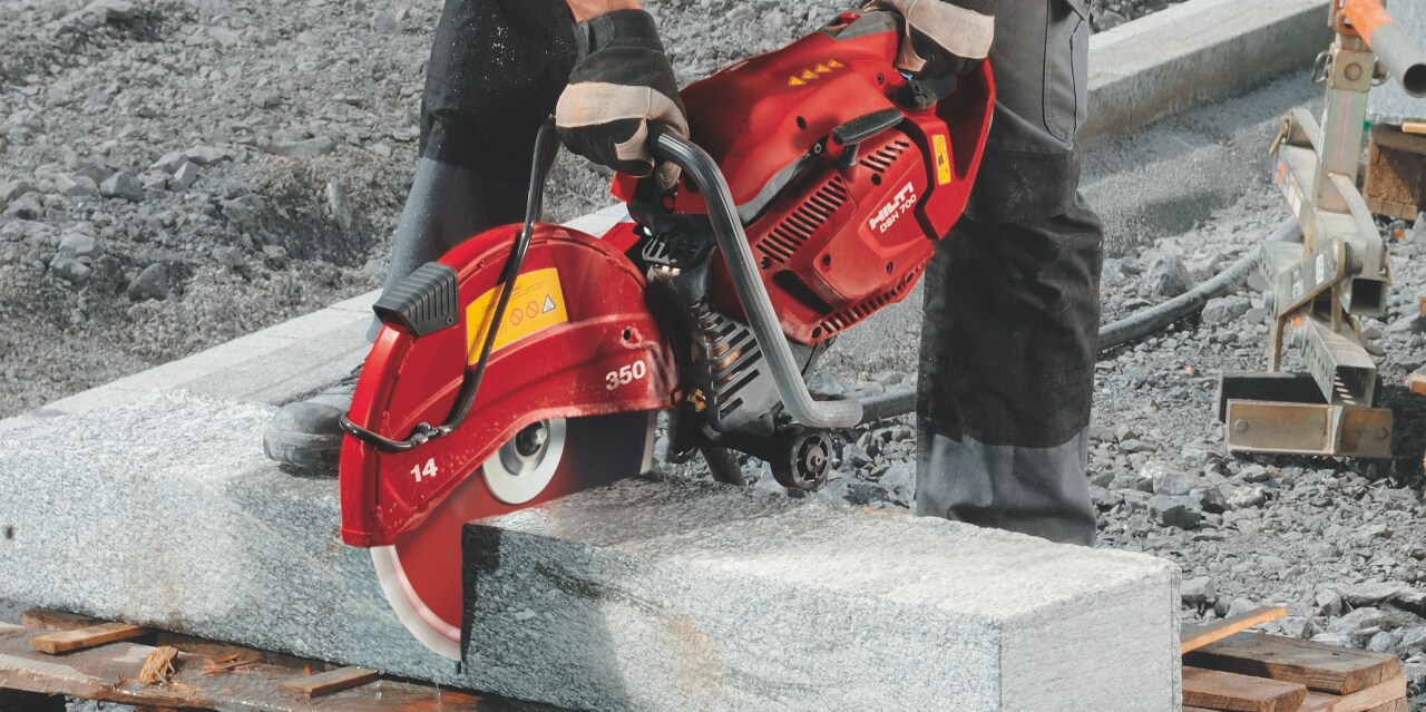 A Hilti saw cutting through a concrete block