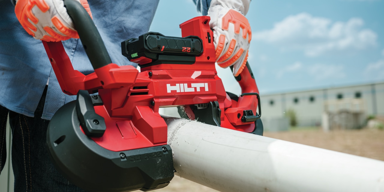 A Hilti band saw cutting through a pipe