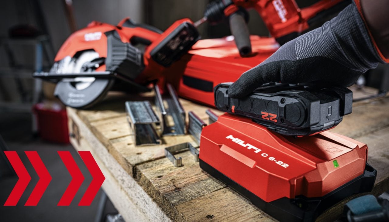 image of person inserting a hilti nuron battery into a hilti battery charger