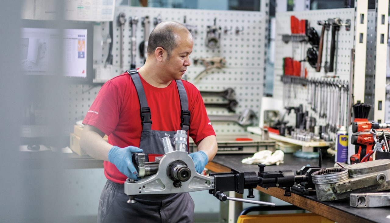 A Hilti service technician repairs a tool
